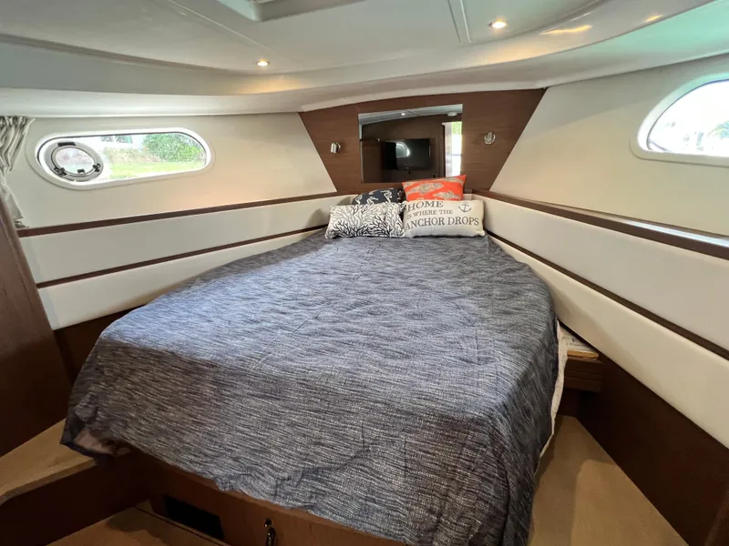Slide: The Image of 2019 Beneteau Swift Trawler 44 cabin with cozy bed and modern design. - 19