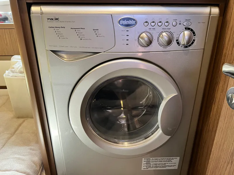 Slide: The Image of Splendide washing machine inside 2019 Beneteau Swift Trawler 44 yacht. - 26
