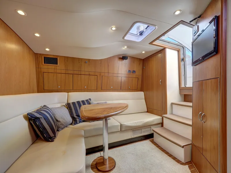 Slide: The Image of Luxurious 2013 Cabo HTX yacht interior with cozy seating and modern amenities. - 10