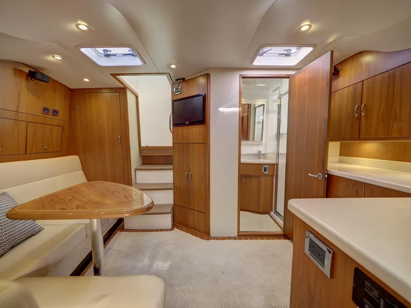 Slide: The Image of Luxurious 2013 Cabo HTX yacht interior with wood finishes and modern amenities. - 12