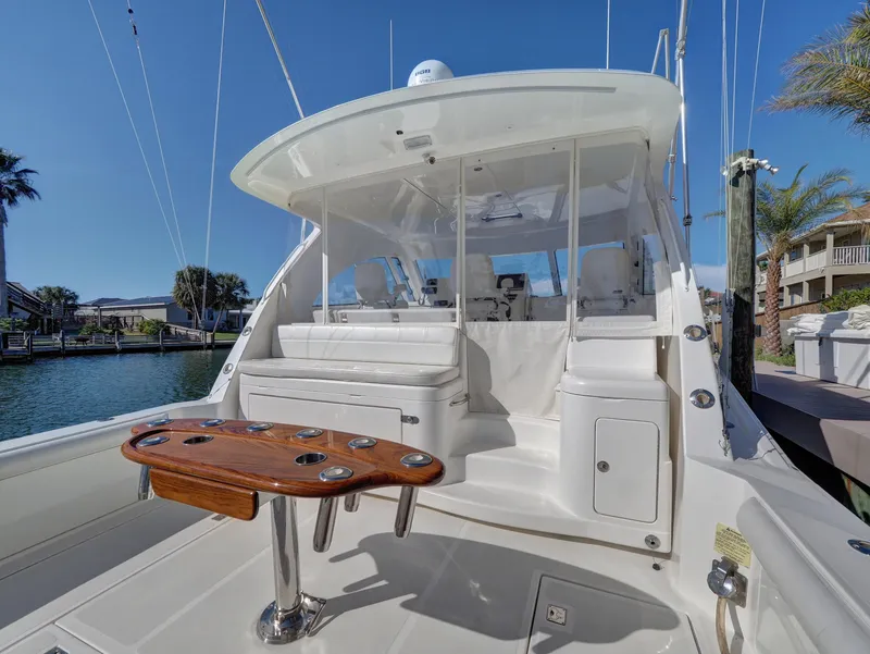 Slide: The Image of 2013 Cabo HTX boat with spacious deck and seating area. - 18