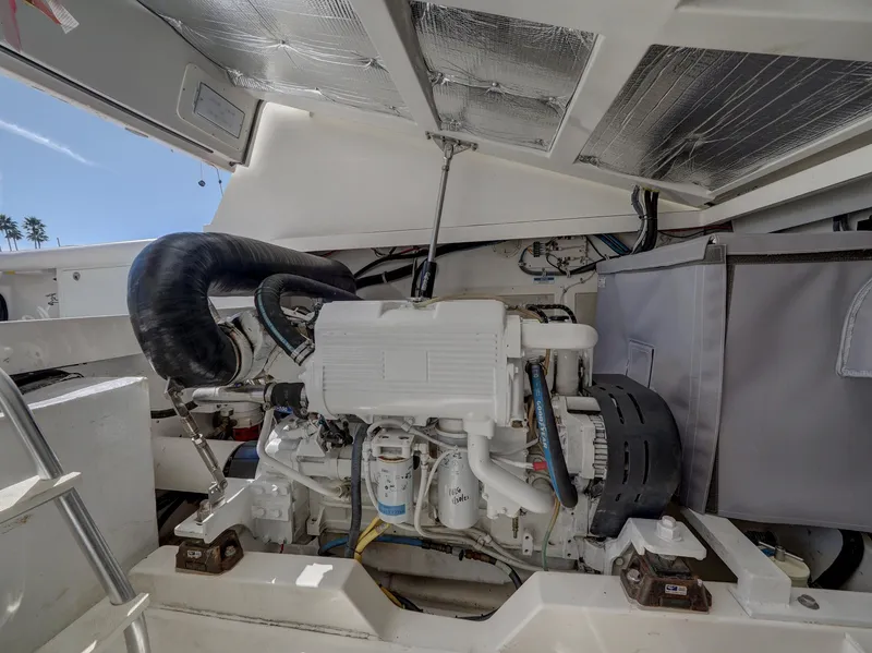 Slide: The Image of Engine compartment of a 2013 Cabo HTX boat, showcasing detailed mechanical components. - 28