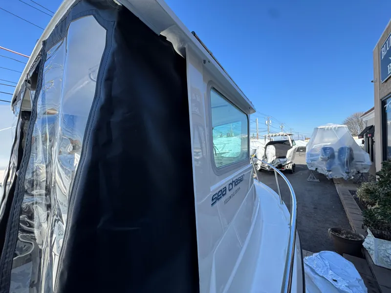 Slide: The Image of 2025 Arima Sea Chaser 19 Yellowtail Edition boat in marina, side view. - 13