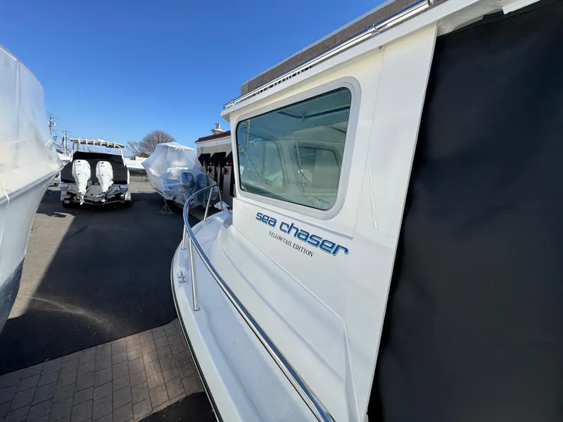 Slide: The Image of 2025 Arima Sea Chaser 19 Yellowtail Edition boat in storage yard. - 14