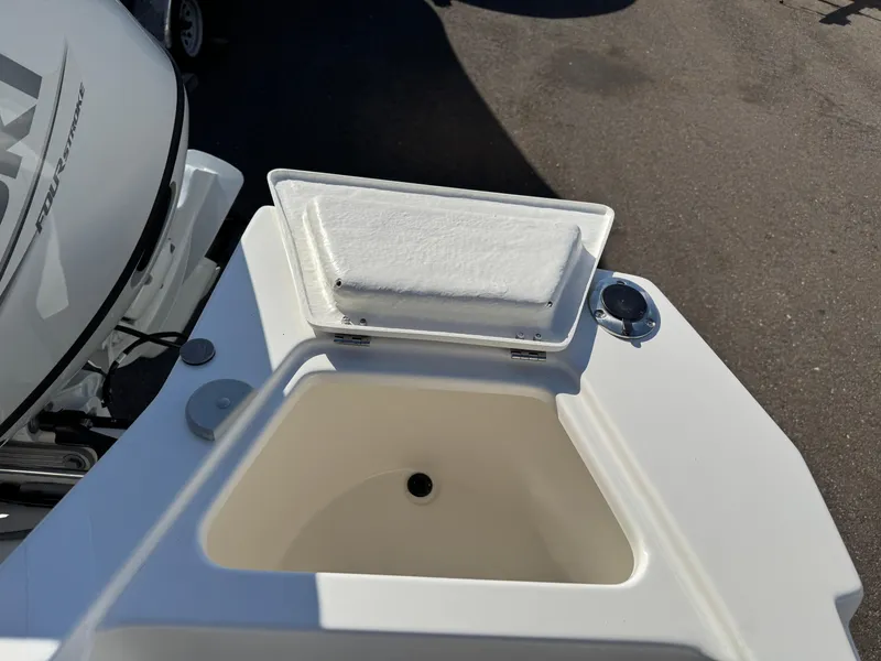 Slide: The Image of 2025 Arima Sea Chaser 19 Yellowtail Edition boat with open storage compartment. - 15