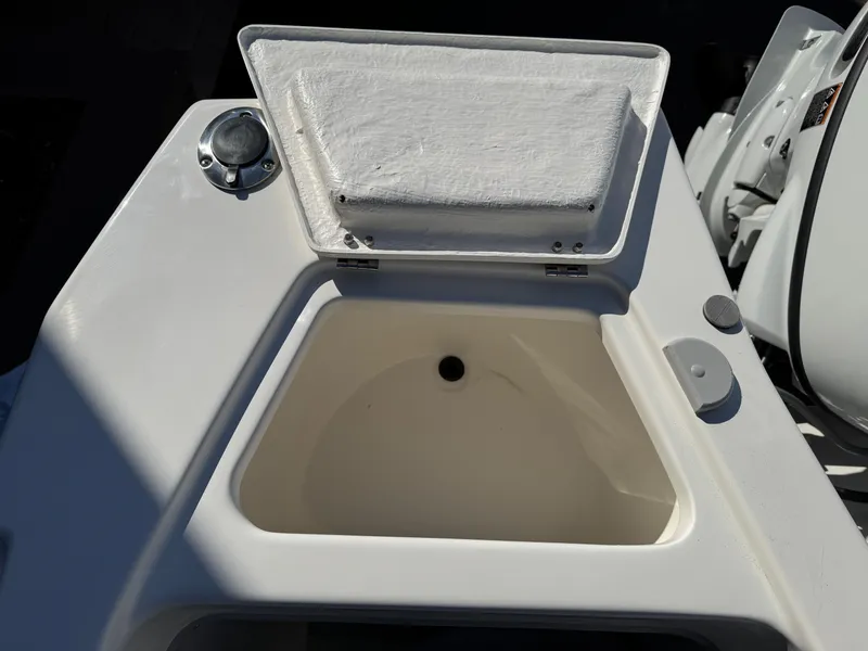 Slide: The Image of 2025 Arima Sea Chaser 19 Yellowtail Edition boat compartment with open lid. - 16