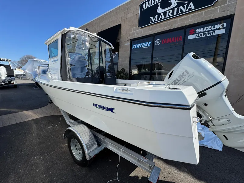 Slide: The Image of 2025 Arima Sea Chaser 19 Yellowtail Edition boat on trailer at marina. - 18