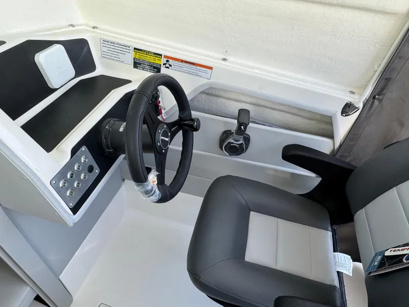 Slide: The Image of 2025 Arima Sea Chaser 19 Yellowtail Edition cockpit with steering wheel and controls. - 4