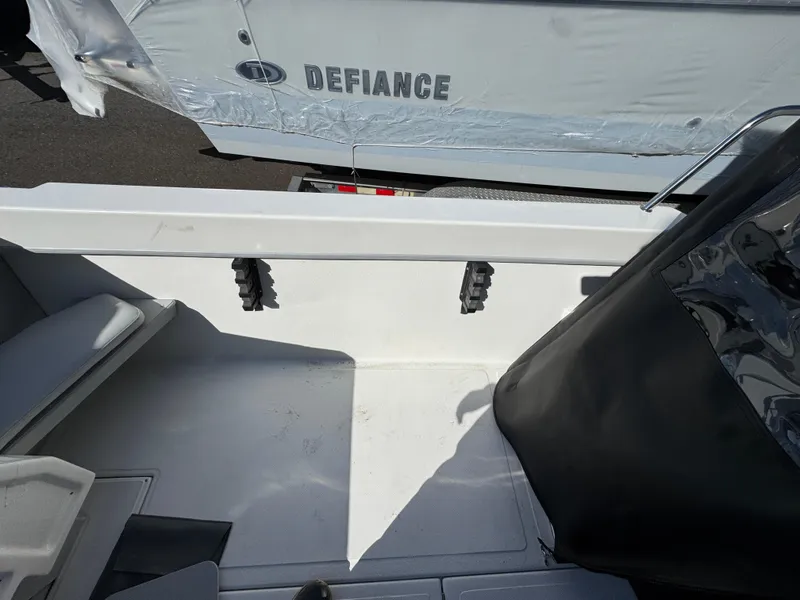 Slide: The Image of Interior view of 2025 Arima Sea Chaser 19 Yellowtail Edition boat, featuring seating and rod holders. - 8