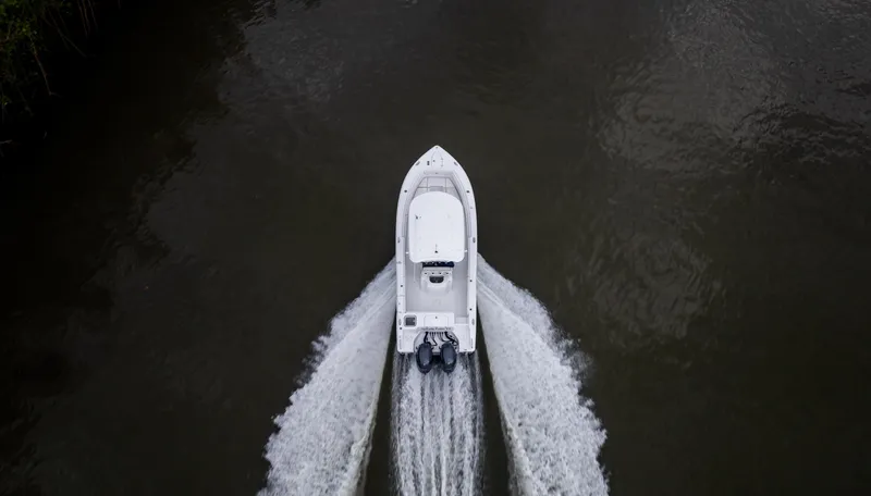 Slide: The Image of Aerial view of 2021 Sea Hunt Gamefish 25 boat cruising on water. - 33