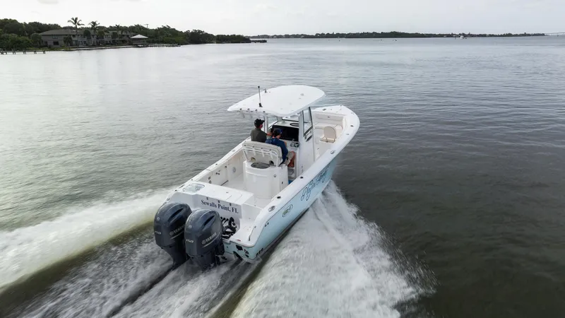 Slide: The Image of 2021 Sea Hunt Gamefish 25 cruising on calm waters, rear view. - 34