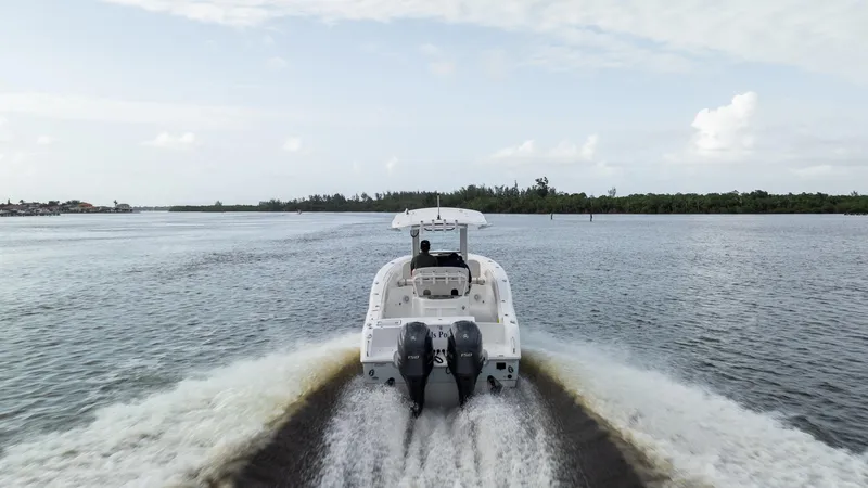 Slide: The Image of 2021 Sea Hunt Gamefish 25 cruising on open water, rear view. - 36