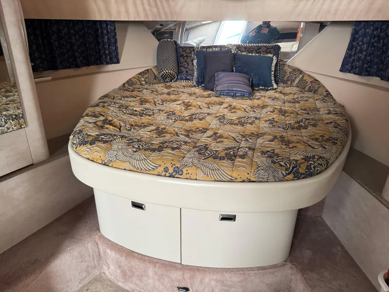 Slide: The Image of Luxurious 2001 Formula 40 Performance Cruiser cabin with plush bedding and elegant decor. - 10