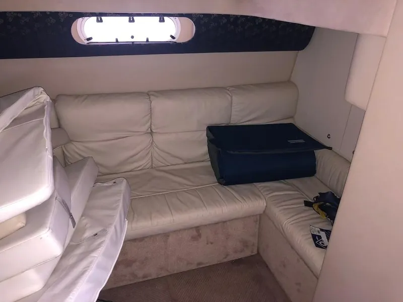 Slide: The Image of Interior of 2001 Formula 40 Performance Cruiser with beige leather seating and a small window. - 12