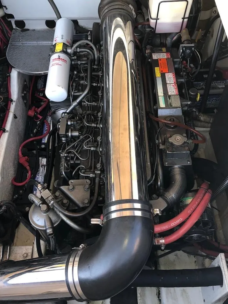 Slide: The Image of Engine compartment of a 2001 Formula 40 Performance Cruiser with visible components and wiring. - 14