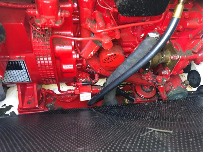 Slide: The Image of Engine compartment of a 2001 Formula 40 Performance Cruiser, featuring red mechanical components. - 16