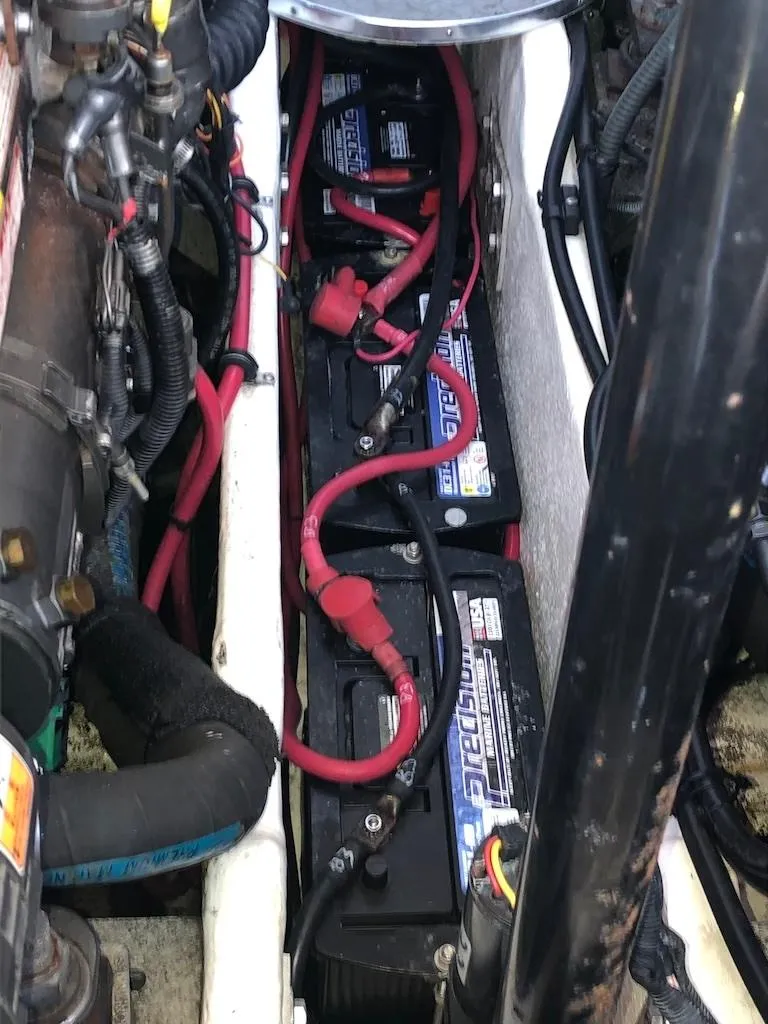 Slide: The Image of Engine compartment of a 2001 Formula 40 Performance Cruiser with visible batteries and wiring. - 17