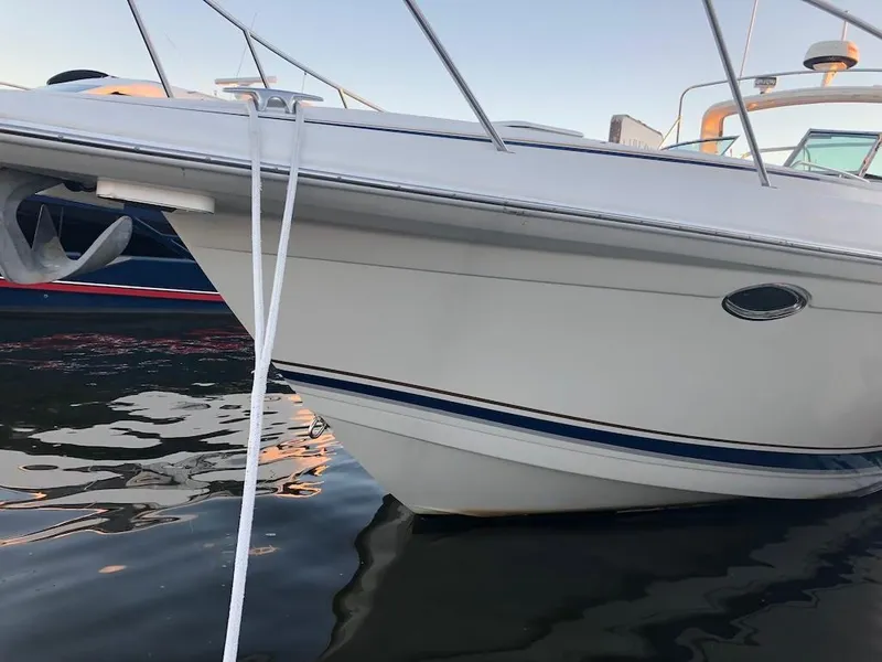 Slide: The Image of 2001 Formula 40 Performance Cruiser docked on calm water. - 7