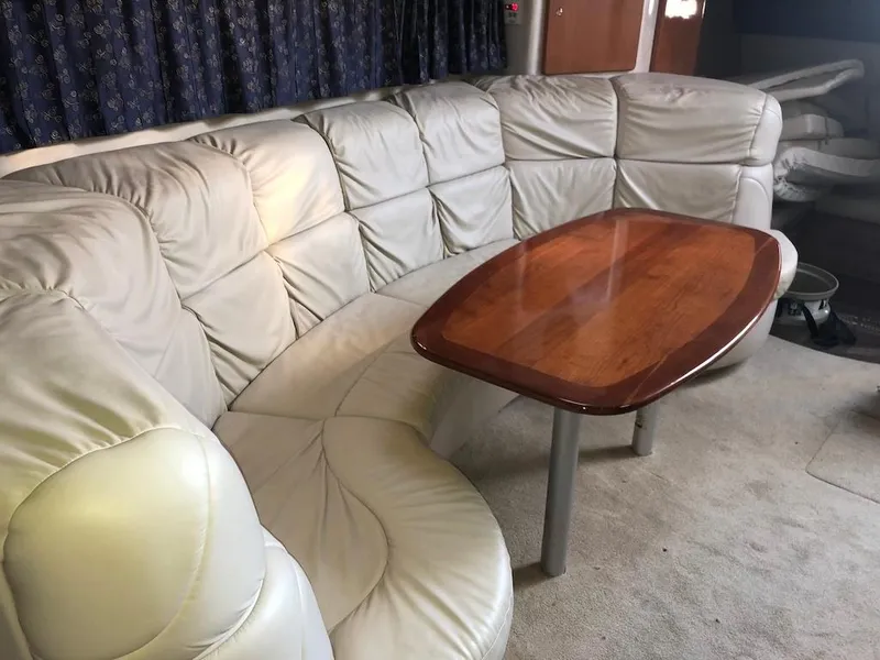 Slide: The Image of 2001 Formula 40 Performance Cruiser interior with leather seating and wooden table. - 9