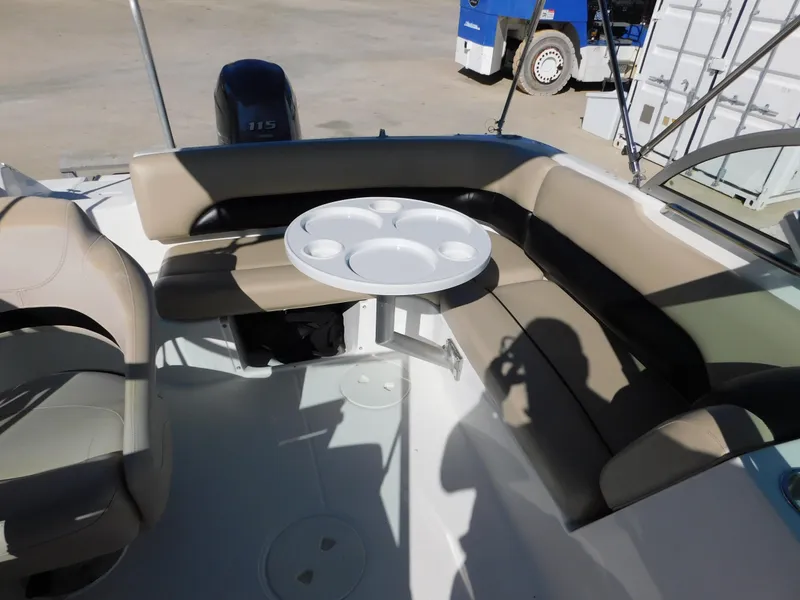 Slide: The Image of 2015 Hurricane SunDeck 187 OB boat interior with seating and table. - 10