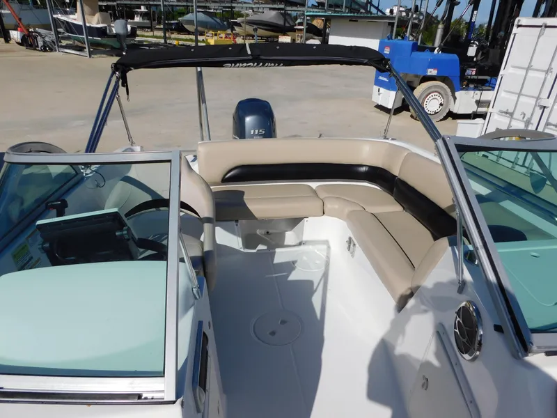 Slide: The Image of 2015 Hurricane SunDeck 187 OB boat interior with seating and windshield. - 11