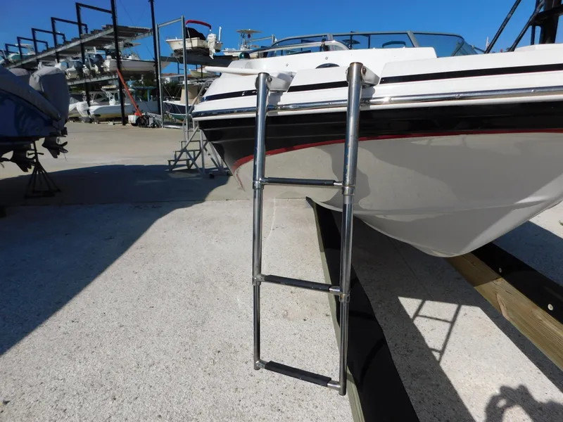 Slide: The Image of 2015 Hurricane SunDeck 187 OB boat with ladder on dry dock. - 18