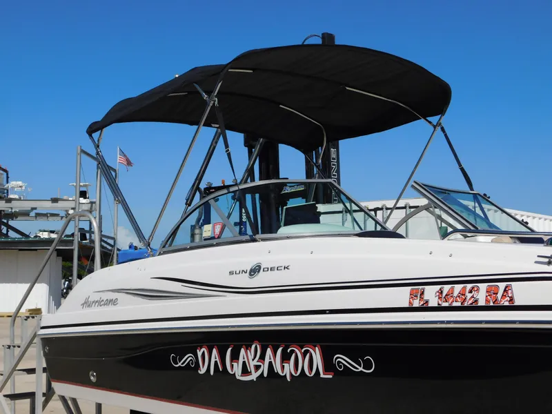 Slide: The Image of 2015 Hurricane SunDeck 187 OB boat with black canopy and custom "Da Gabagool" lettering. - 7