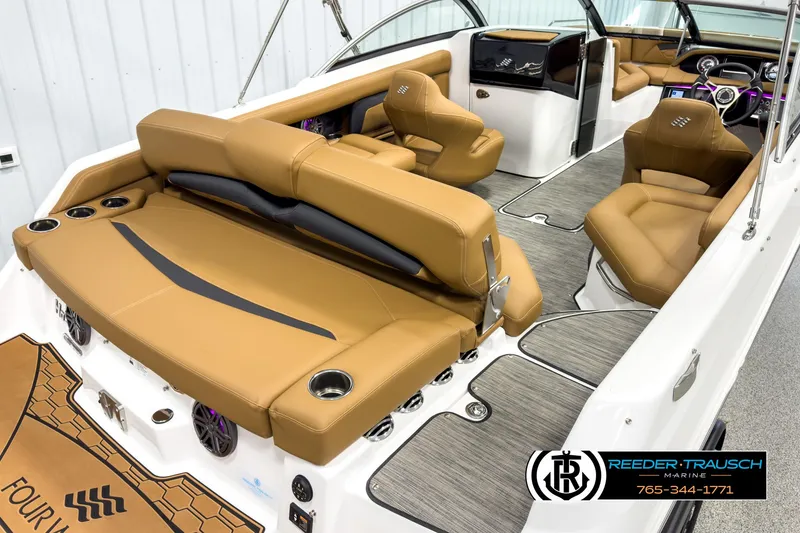 Slide: The Image of 2025 Four Winns HD3 boat interior with tan leather seats and modern design. - 12