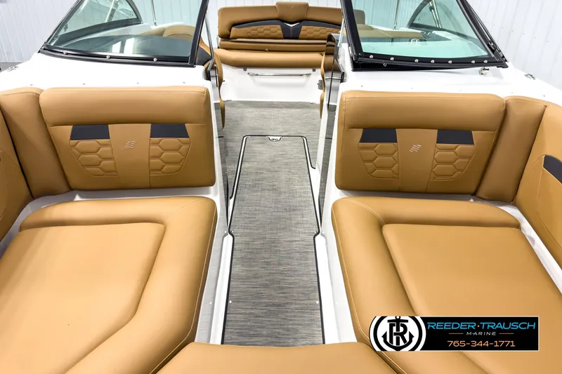 Slide: The Image of 2025 Four Winns HD3 boat interior with tan leather seating and modern design. - 17