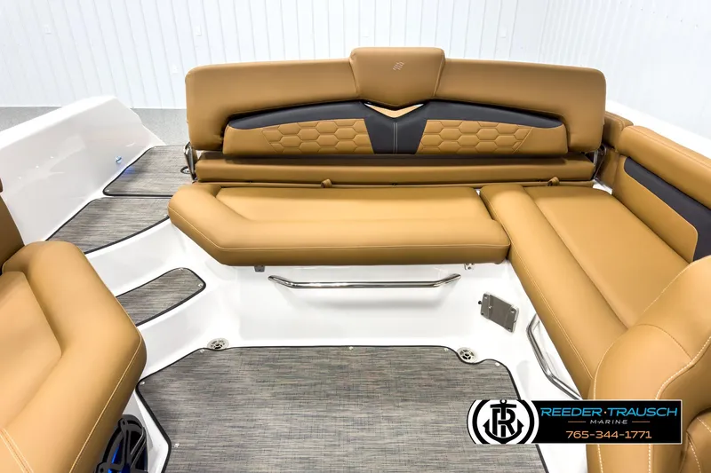 Slide: The Image of 2025 Four Winns HD3 boat interior with tan leather seating and modern design. - 19