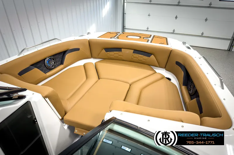 Slide: The Image of 2025 Four Winns HD3 boat interior with tan seating and modern design. - 21
