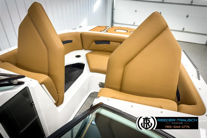 Slide: The Image of 2025 Four Winns HD3 boat interior with tan seating, showcasing modern design and comfort. - 22