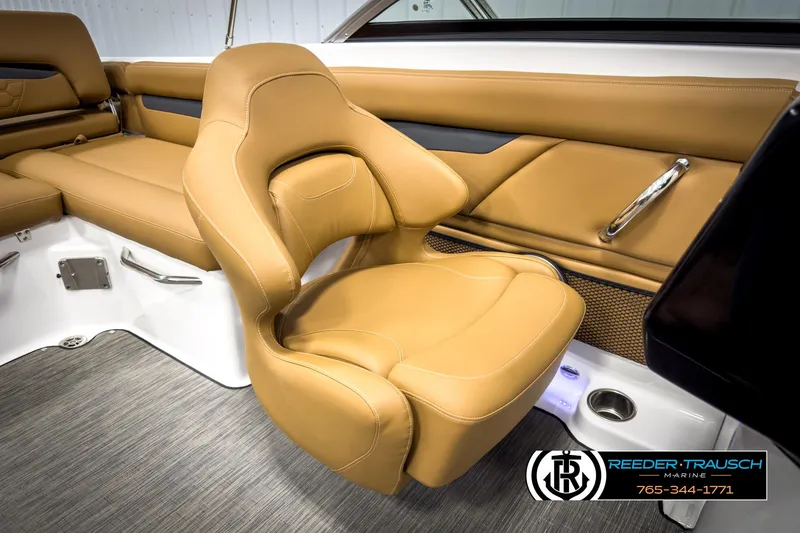 Slide: The Image of 2025 Four Winns HD3 boat interior with tan leather seating and modern design. - 25