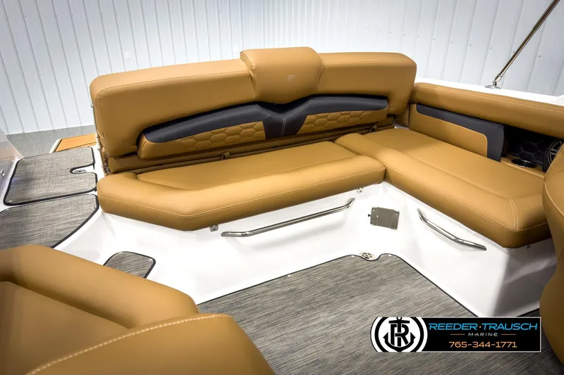 Slide: The Image of 2025 Four Winns HD3 boat interior with tan seating and modern design. - 28