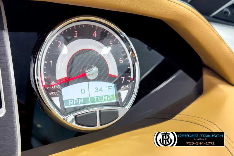 Slide: The Image of Dashboard of 2025 Four Winns HD3 boat showing RPM and temperature gauge. - 34