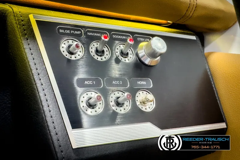 Slide: The Image of Control panel of 2025 Four Winns HD3 boat with labeled switches and knobs. - 35