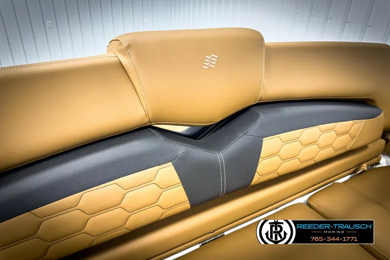 Slide: The Image of 2025 Four Winns HD3 boat seat with tan and black hexagonal pattern upholstery. - 38