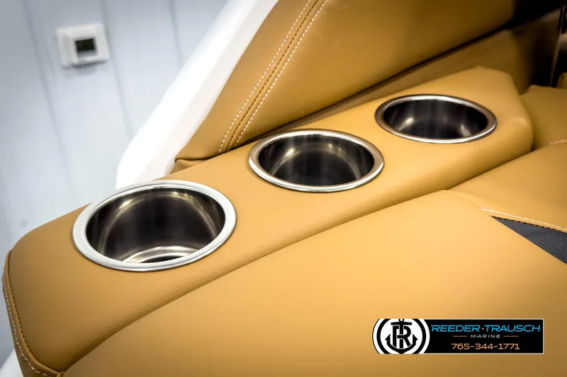 Slide: The Image of Luxurious tan leather seating with cup holders in 2025 Four Winns HD3 boat. - 44