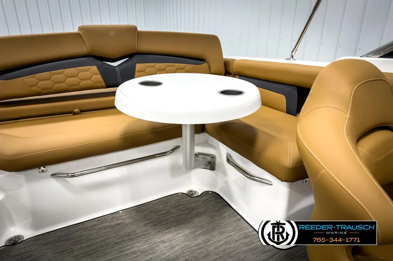 Slide: The Image of 2025 Four Winns HD3 boat interior with tan seating and a white table. - 48
