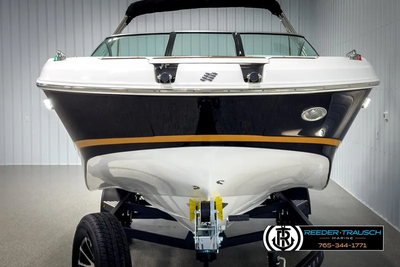 Slide: The Image of 2025 Four Winns HD3 boat on trailer in showroom, front view. - 8