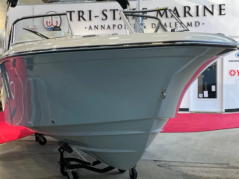 Slide: The Image of 2025 Grady-White Freedom 215 boat displayed at Tri-State Marine showroom. - 3