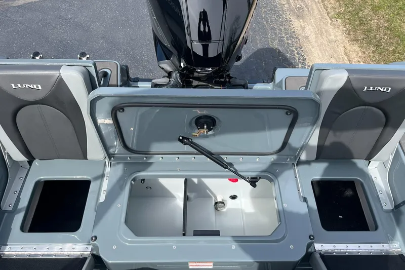 Slide: The Image of 2025 Lund 185 Impact GL boat interior with storage compartments open. - 11