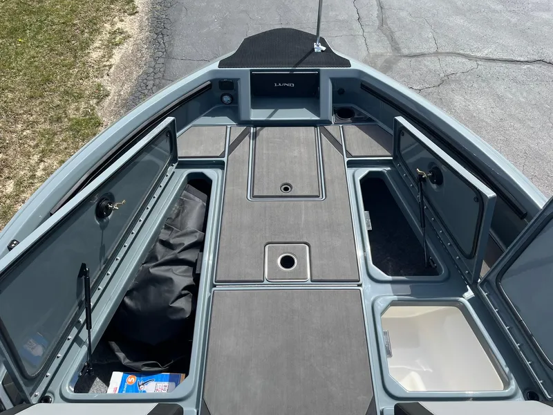 Slide: The Image of 2025 Lund 185 Impact GL boat interior with open storage compartments. - 13
