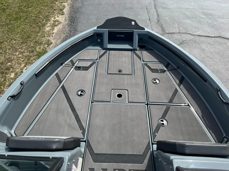 Slide: The Image of 2025 Lund 185 Impact GL boat deck with sleek, modern design and ample storage compartments. - 14
