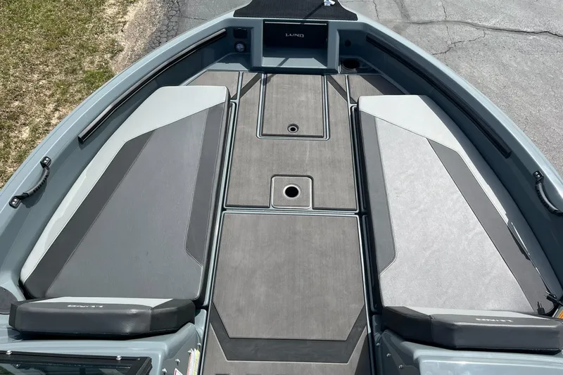 Slide: The Image of 2025 Lund 185 Impact GL boat deck with sleek, modern design and spacious layout. - 16