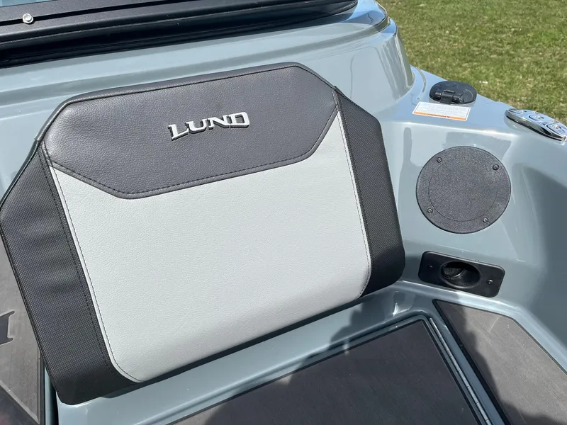 Slide: The Image of 2025 Lund 185 Impact GL boat seat with logo, featuring sleek design and durable materials. - 19