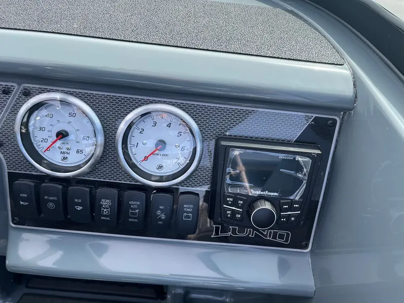 Slide: The Image of Dashboard of 2025 Lund 185 Impact GL boat with gauges and controls. - 26