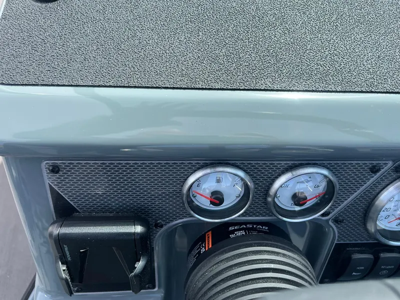 Slide: The Image of Dashboard of 2025 Lund 185 Impact GL boat with gauges and controls. - 27