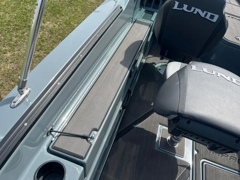 Slide: The Image of 2025 Lund 185 Impact GL boat interior with seating and storage compartments. - 31