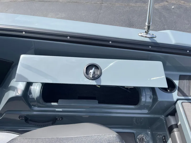 Slide: The Image of 2025 Lund 185 Impact GL boat interior storage compartment with open lid. - 33